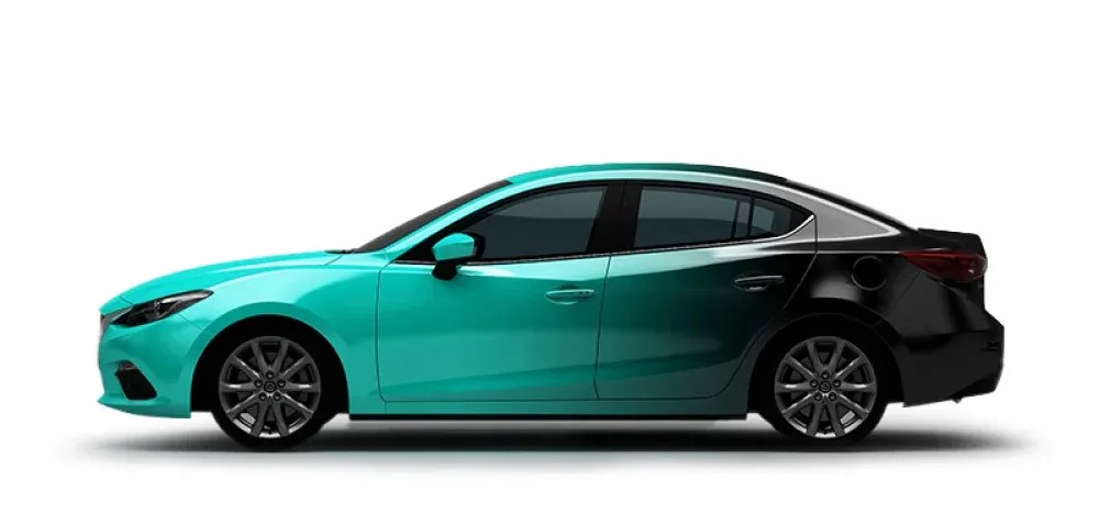 A side view of a sleek sedan car with a two-tone paint job, featuring a vibrant teal color on the front and black on the rear.