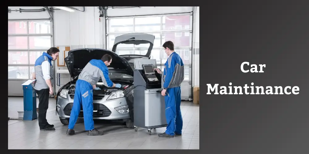 Mechanics performing car maintenance in a garage.