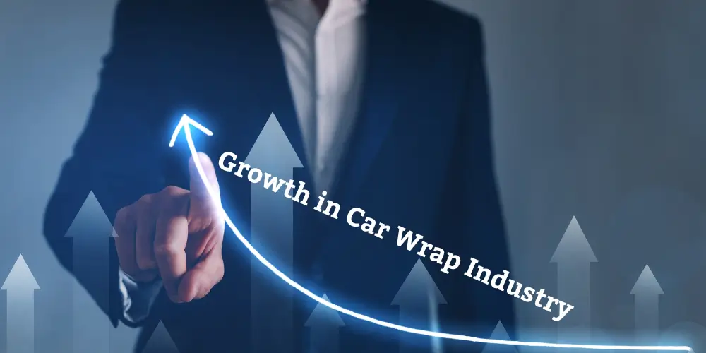 Business professional pointing at an upward arrow labeled 'Growth in Car Wrap Industry' indicating industry expansion