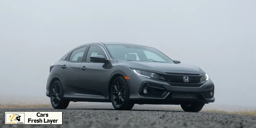 A sleek gray Honda Civic parked on a foggy road, exuding a modern and stylish vibe.