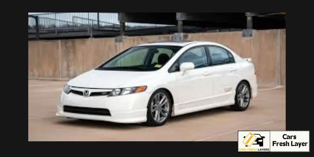 A white 8th-generation Honda Civic sedan (2006–2011) with a sleek aftermarket body kit, parked in an open concrete lot.